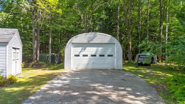 garage with a yard