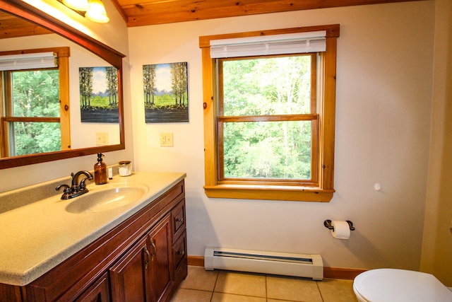 bathroom featuring a baseboard heating unit, vanity, toilet, and tile patterned flooring