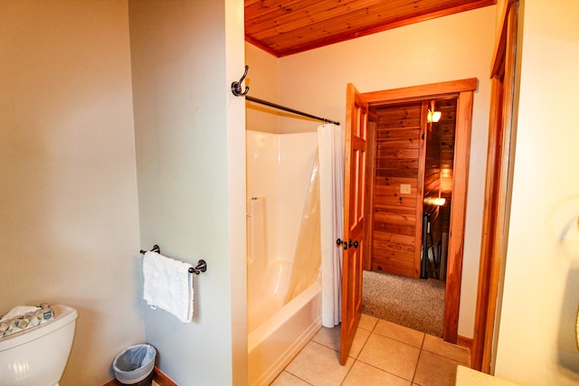 bathroom with wooden ceiling, toilet, tile patterned flooring, and shower / bath combo with shower curtain