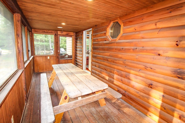 unfurnished sunroom featuring wooden ceiling