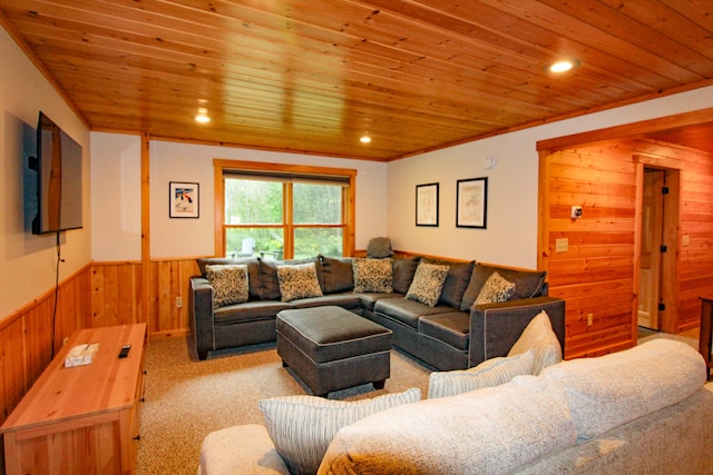 living room featuring wooden ceiling, ornamental molding, light colored carpet, and wooden walls