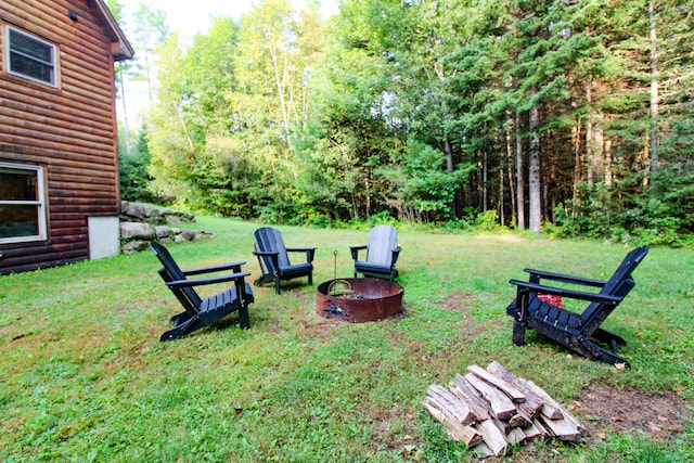 view of yard with an outdoor fire pit