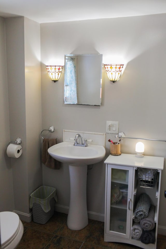 bathroom featuring sink and toilet