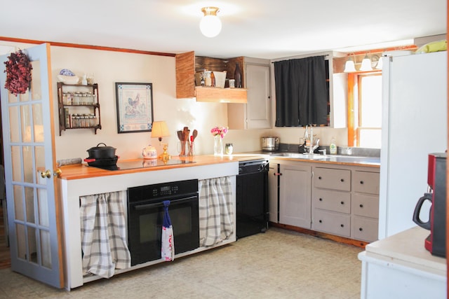 kitchen featuring gray cabinets, sink, and black appliances