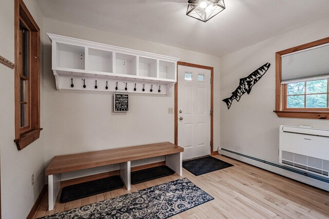 mudroom featuring wood-type flooring and a baseboard radiator