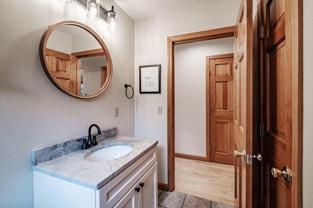 bathroom featuring vanity and hardwood / wood-style floors