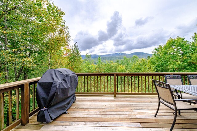 deck featuring a mountain view and area for grilling