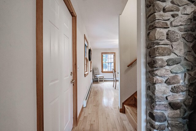 hall with light hardwood / wood-style flooring