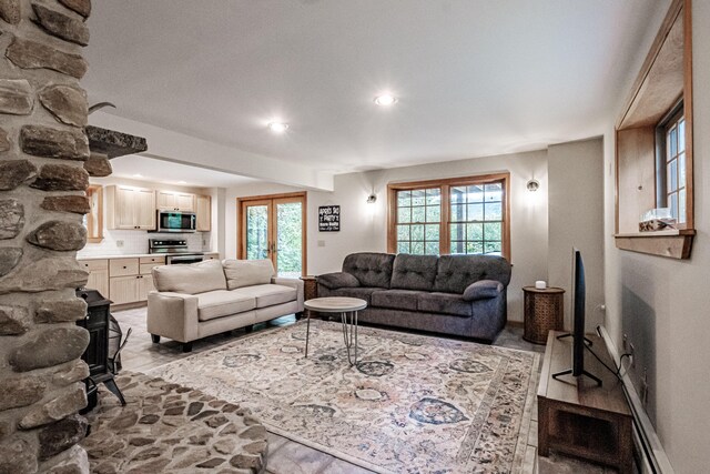 living room with french doors and beamed ceiling