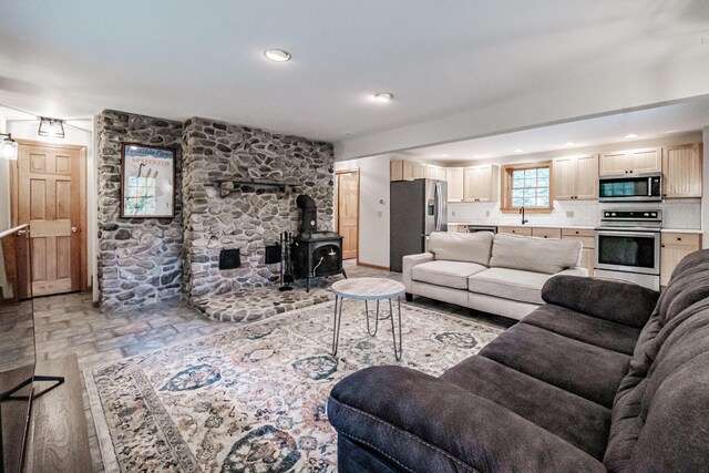 living room with a wood stove