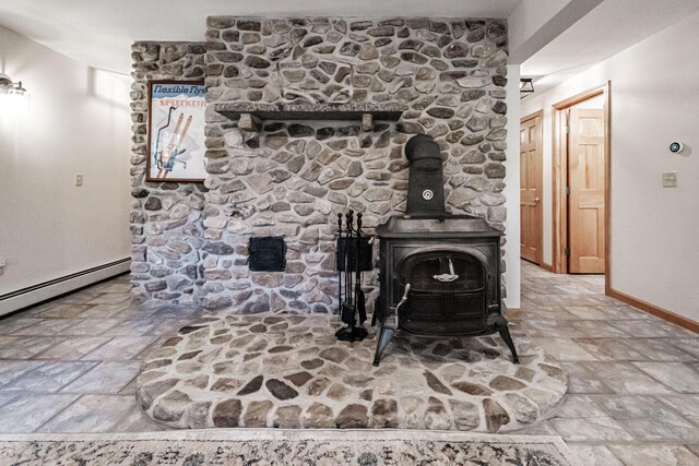 details featuring baseboard heating and a wood stove