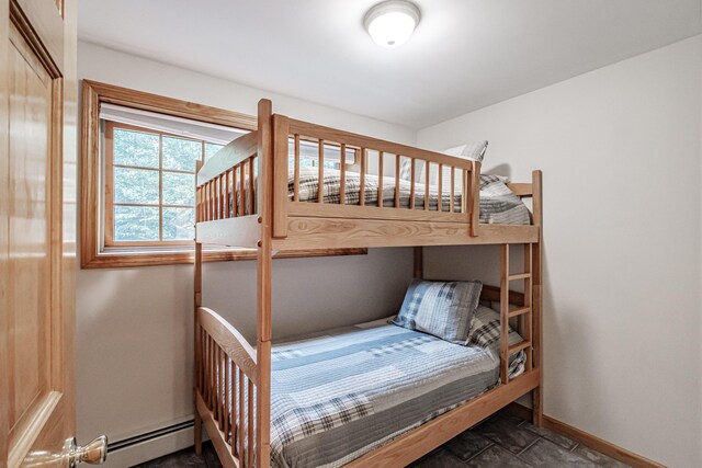 bedroom featuring a baseboard heating unit