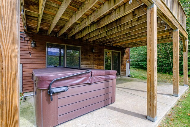 view of patio / terrace with a hot tub