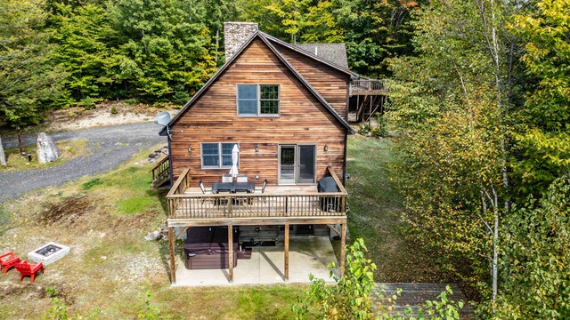 rear view of property with a patio area and a deck