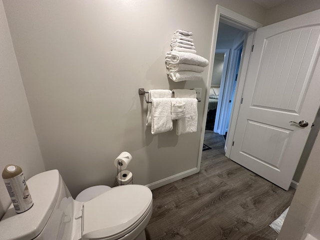 bathroom featuring toilet and hardwood / wood-style floors