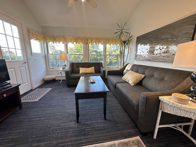 living room with lofted ceiling, dark carpet, a baseboard radiator, and ceiling fan