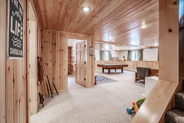 rec room with wooden walls, a baseboard heating unit, pool table, wooden ceiling, and light carpet