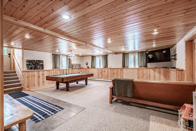 game room featuring pool table, wooden ceiling, light colored carpet, wooden walls, and a baseboard radiator