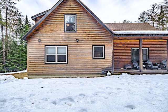 view of snow covered house