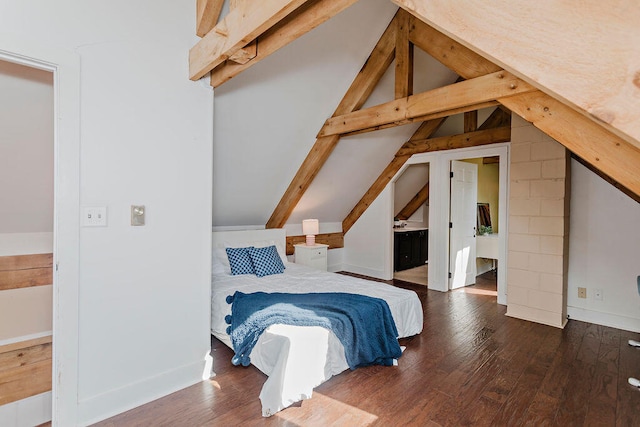 bedroom featuring lofted ceiling and dark hardwood / wood-style flooring