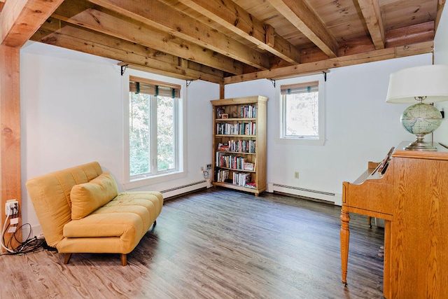 living area with beamed ceiling, a baseboard heating unit, wooden ceiling, and dark hardwood / wood-style flooring