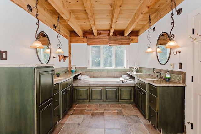 bathroom with beamed ceiling, vanity, wooden ceiling, and a bathtub