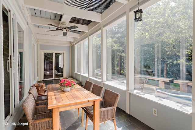 sunroom with beamed ceiling and ceiling fan