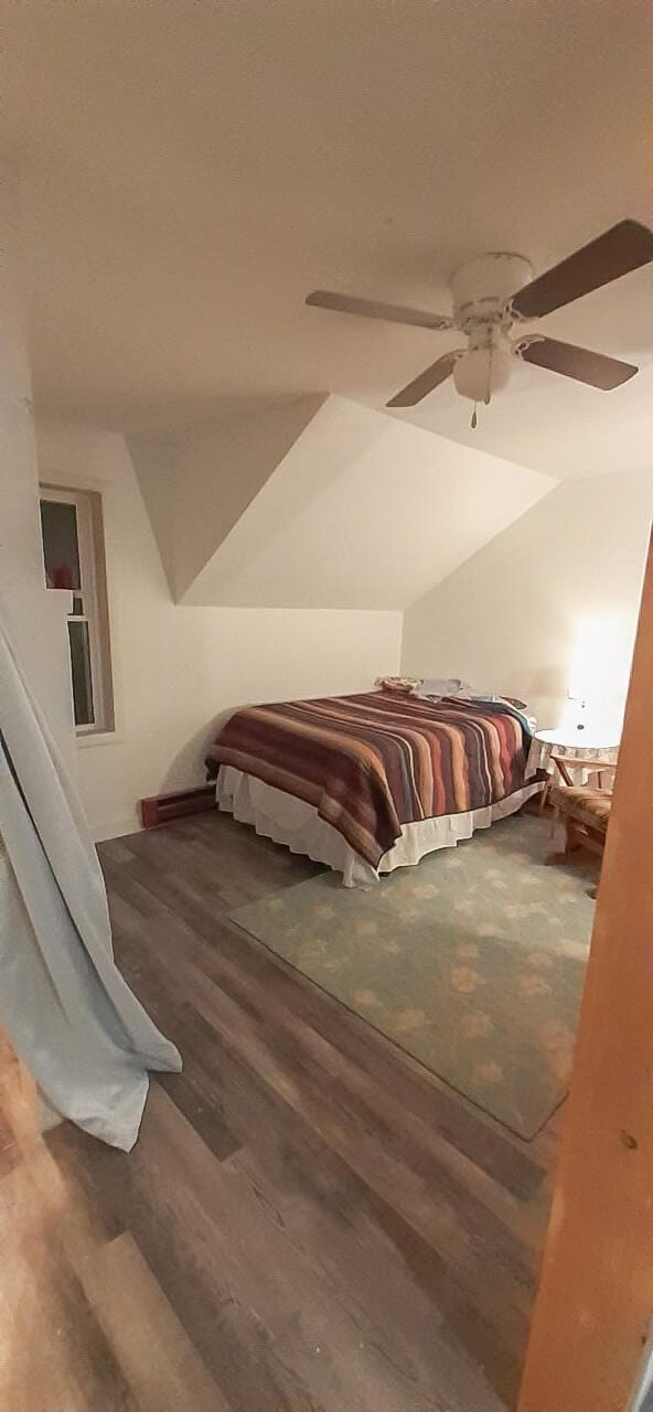 bedroom featuring hardwood / wood-style flooring and ceiling fan