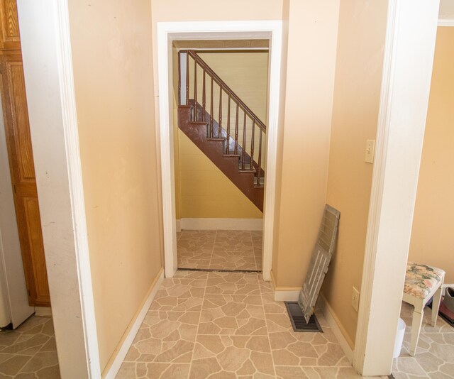 stairs featuring tile patterned flooring