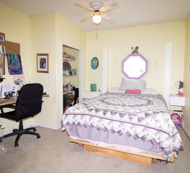 bedroom with ceiling fan and carpet floors