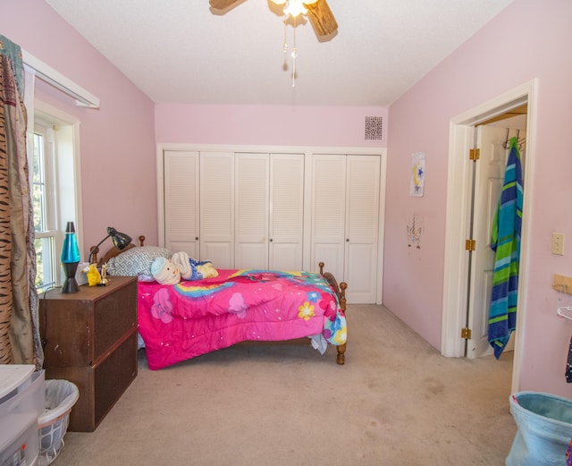 bedroom with ceiling fan and light carpet