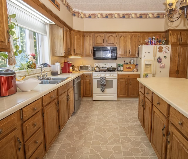 kitchen featuring sink, light tile patterned floors, and white appliances