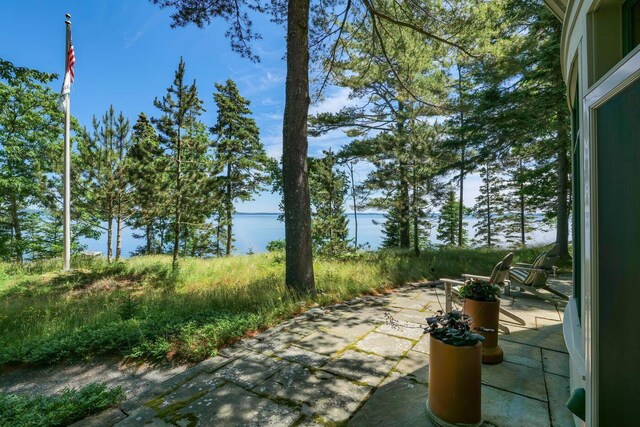 view of patio featuring a water view