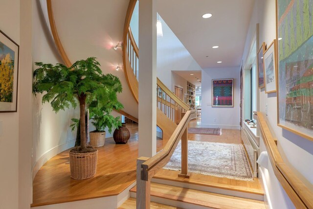 corridor featuring hardwood / wood-style floors