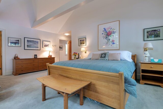 carpeted bedroom featuring high vaulted ceiling