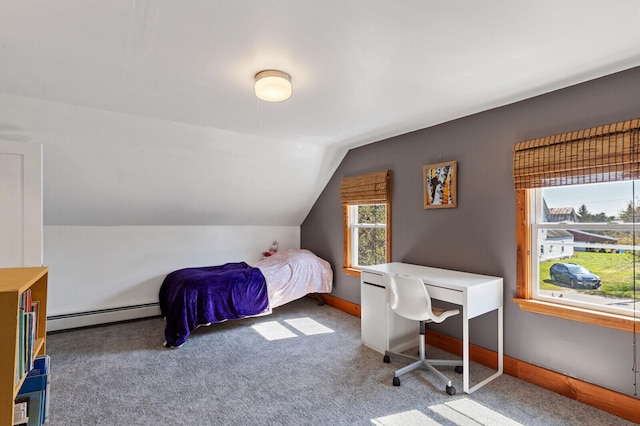 carpeted bedroom featuring a baseboard radiator and vaulted ceiling