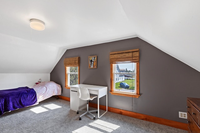 carpeted bedroom with vaulted ceiling