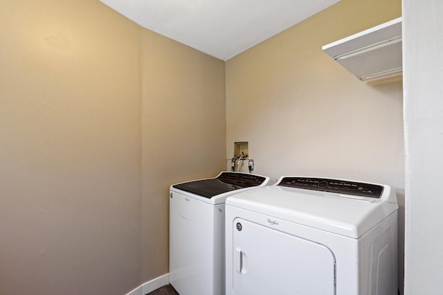 clothes washing area featuring washing machine and clothes dryer