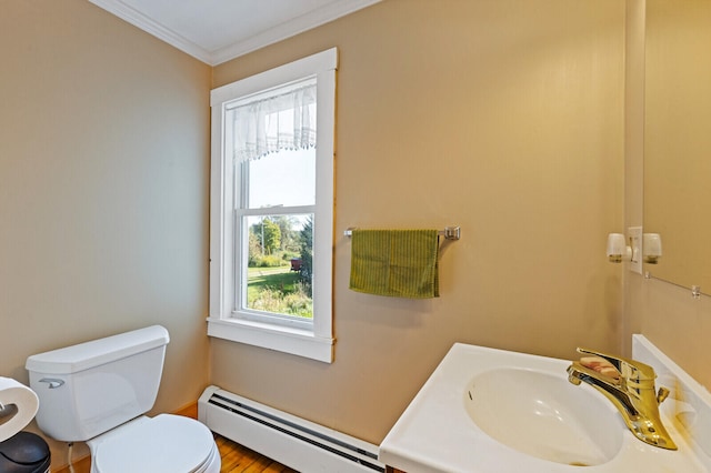 bathroom with vanity, hardwood / wood-style floors, crown molding, toilet, and baseboard heating