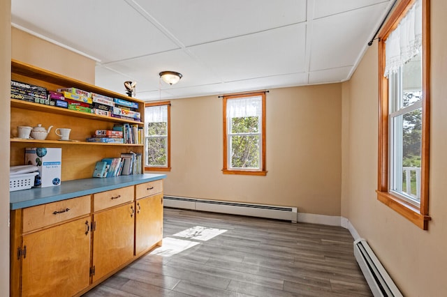 kitchen featuring baseboard heating and light wood-type flooring