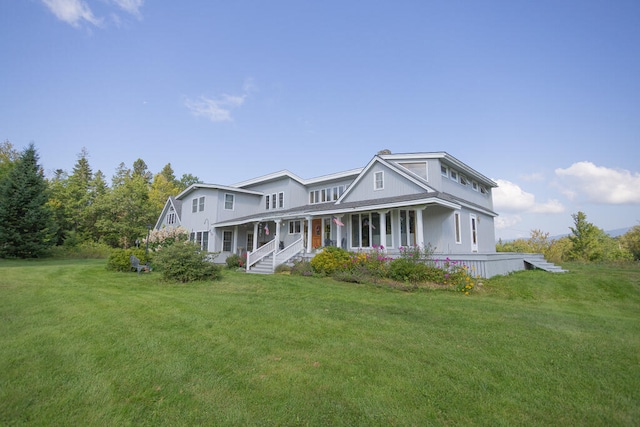 view of front of house featuring a front lawn and covered porch