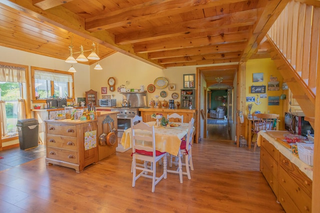 dining area featuring wood ceiling, light hardwood / wood-style floors, and lofted ceiling with beams