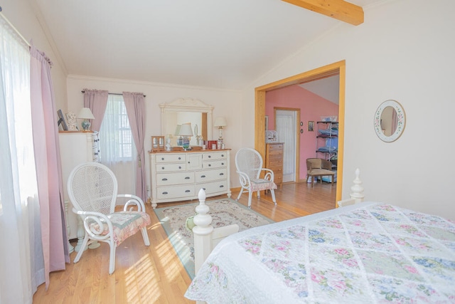 bedroom with vaulted ceiling with beams and light hardwood / wood-style floors