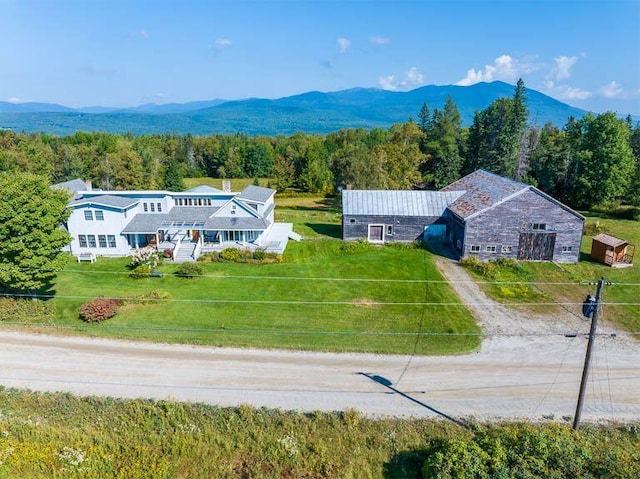 birds eye view of property with a mountain view