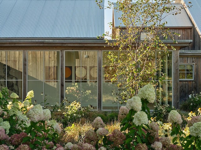 76 N St, Kennebunkport, ME 04046 - view of side of home featuring metal roof and a sunroom