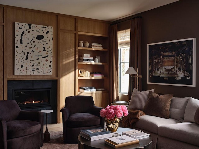 76 N St, Kennebunkport, ME 04046 - carpeted living area featuring built in features and a warm lit fireplace
