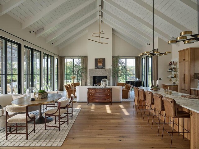 76 N St, Kennebunkport, ME 04046 - sunroom with a healthy amount of sunlight, beamed ceiling, and a notable chandelier