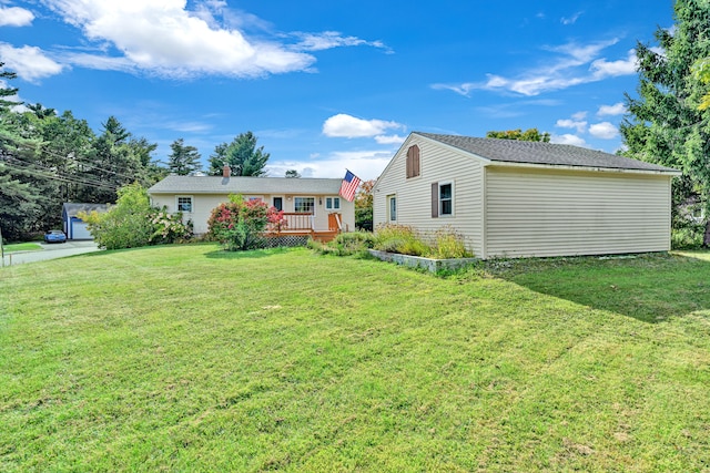 back of property featuring a lawn