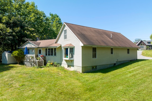 rear view of house with a lawn