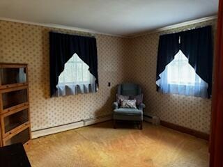 sitting room featuring crown molding